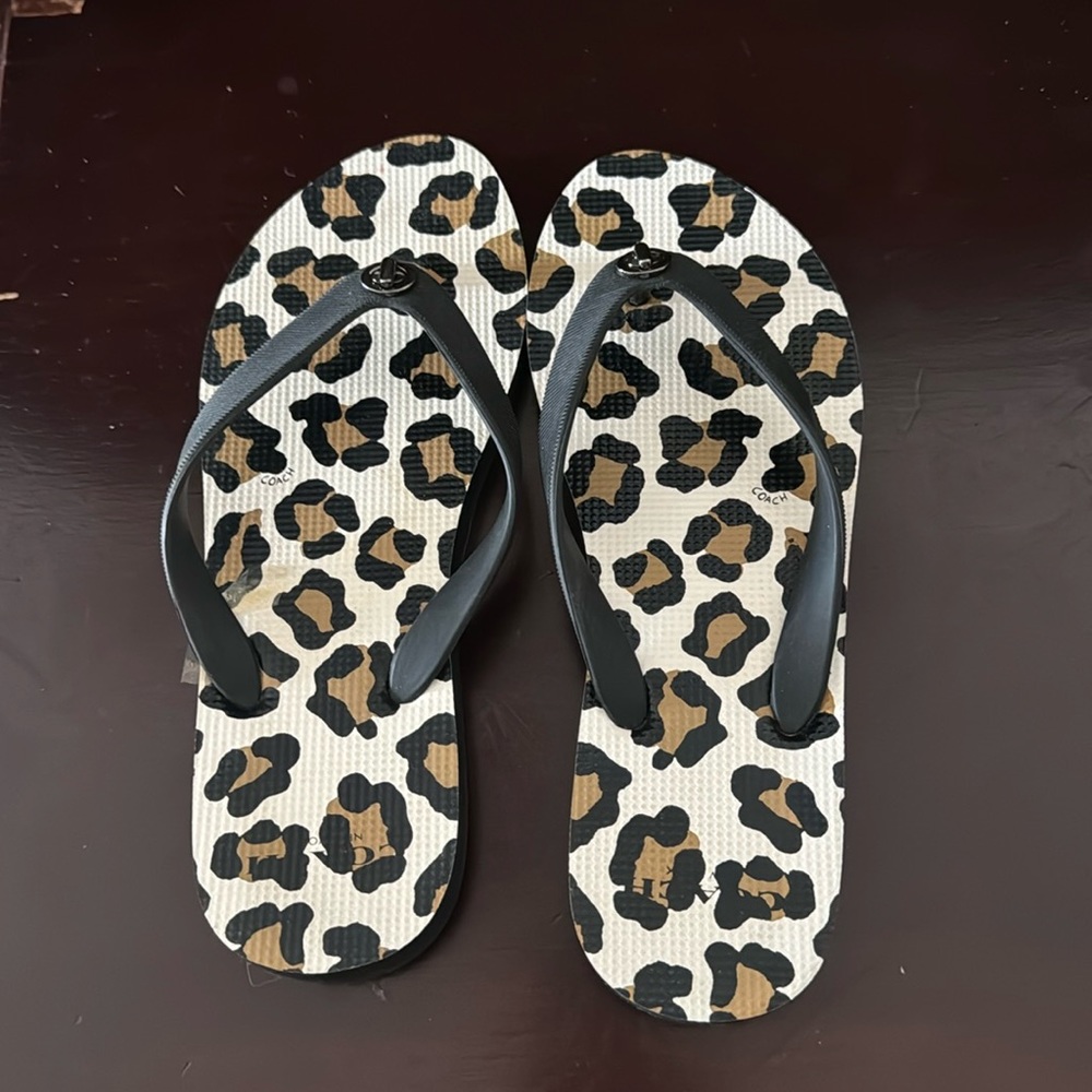 Beautiful coach flip flops. Size 5-6. Only worn once.